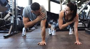 Toning Bingo Wings: Your Ultimate Guide to Sculpting Sleek Arms at the Gym 3 Fitness trainer demonstrating arm toning exercises Walton-on-Thames