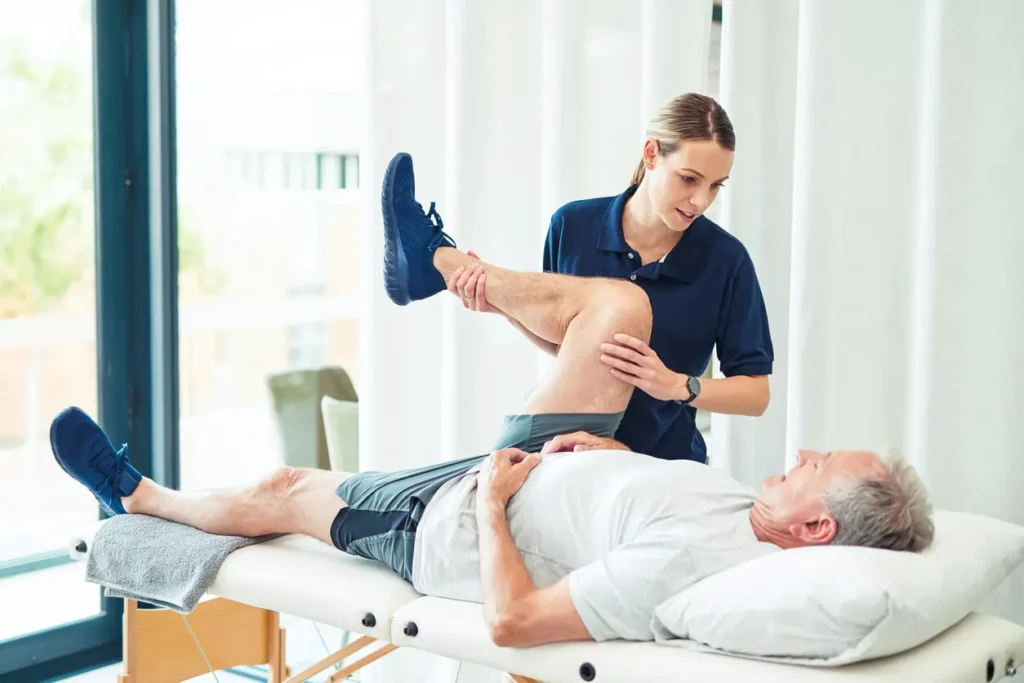 Revitalising Recovery: Effective Rehabilitation Strategies for Muscle Injuries 3 Physiotherapist assisting a patient with muscle recovery exercises Walton-on-Thames