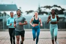 image of man and 3 women doing cardio exercise Walton-on-Thames to help tone and remove fat from the body.